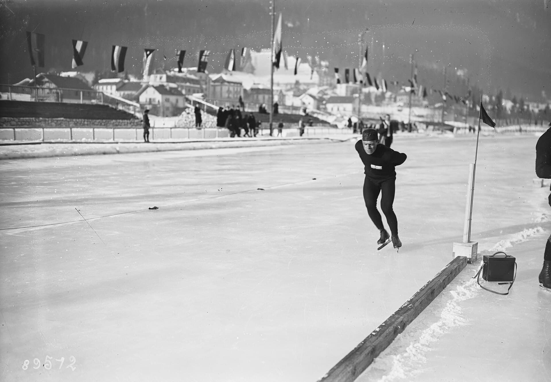 Speed skater Clas Thunberg races on the outdoor ice at Chamonix during the 1924 winter games.