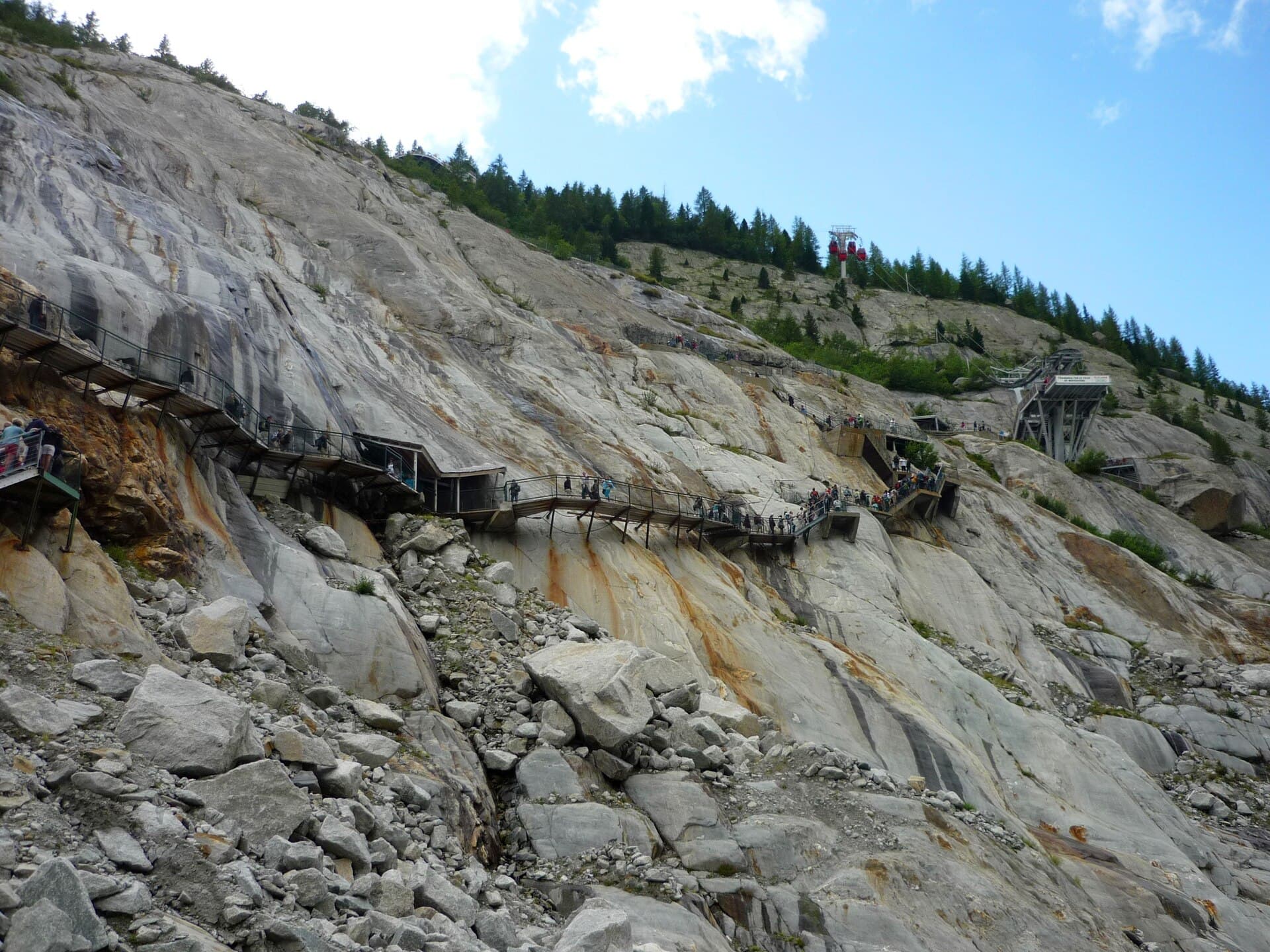 Metal staircases zigzag down bare rock towards the Mer de Glace in 2010.
