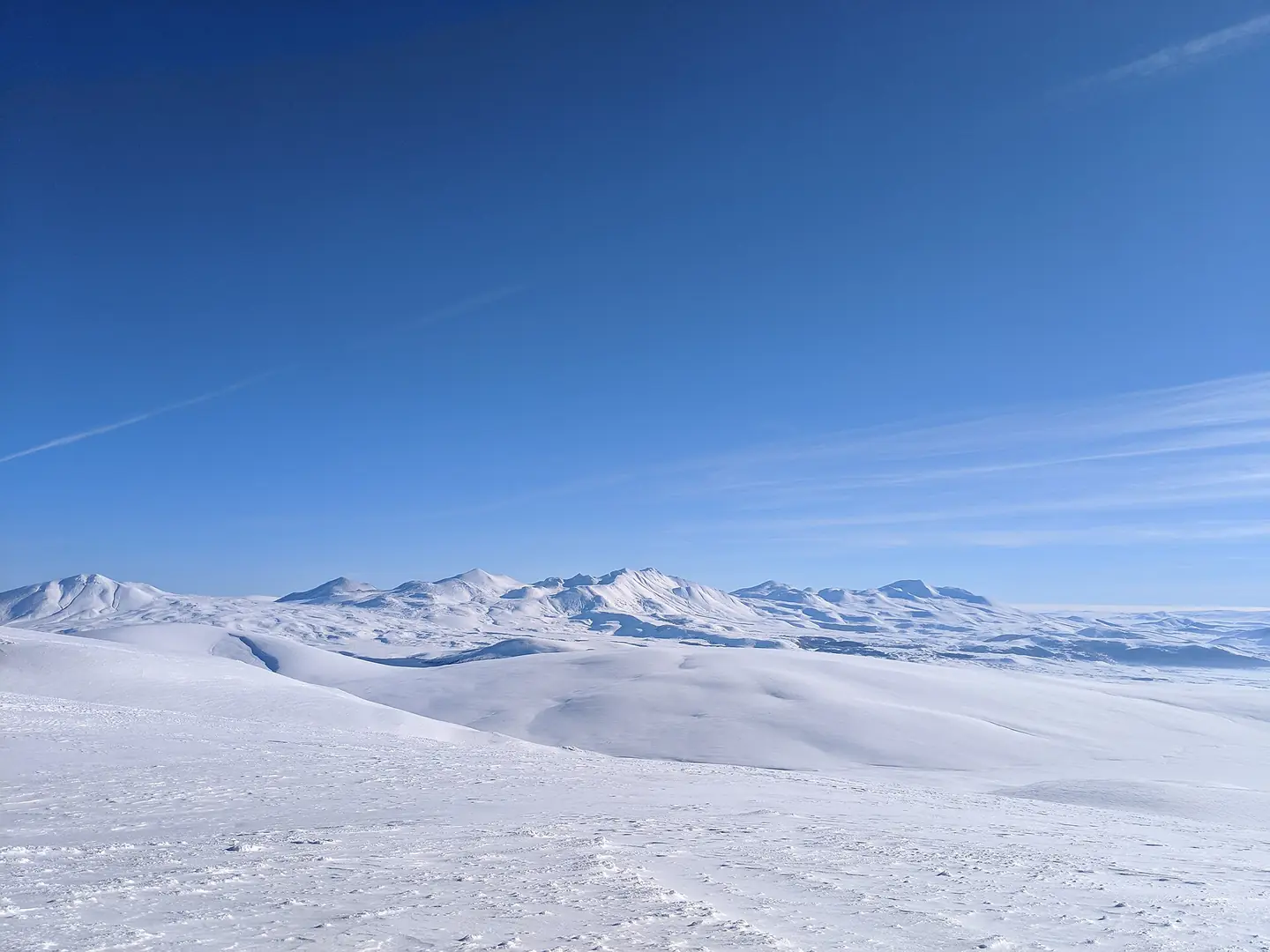 Photograph of snow-capped mountains in the Ktsia-Tabatskuri Managed Reserve. Taken from the top of the highest ski lift accessible in the Bakuriani ski resort in late December 2018