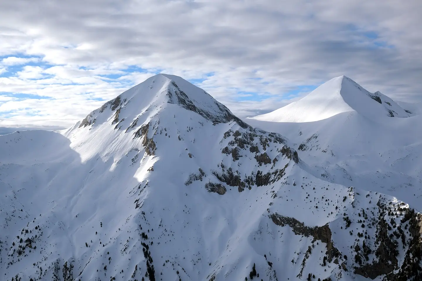 View of Vihren, the highest peak of Bulgaria's Pirin Mountains, from Bansko ski center. Kutelo peak on the right