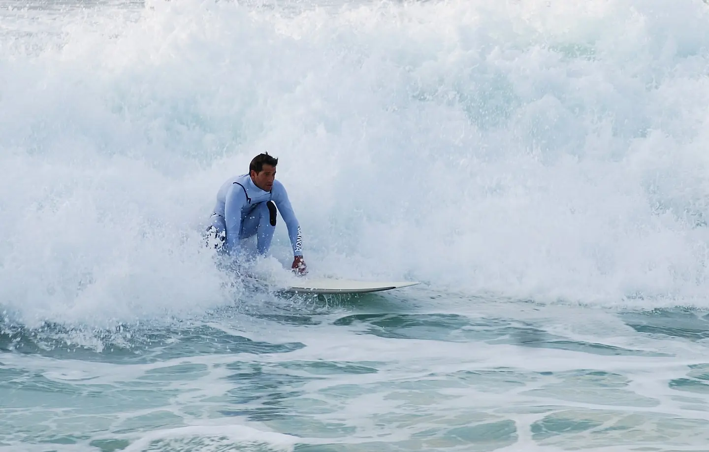 Surfer at the beach of Costa da Caparica, Portugal