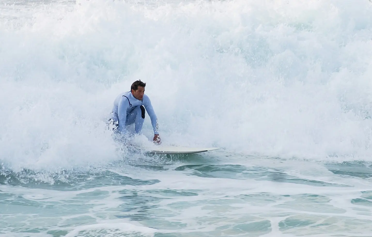 Surfer at the beach of Costa da Caparica, Portugal