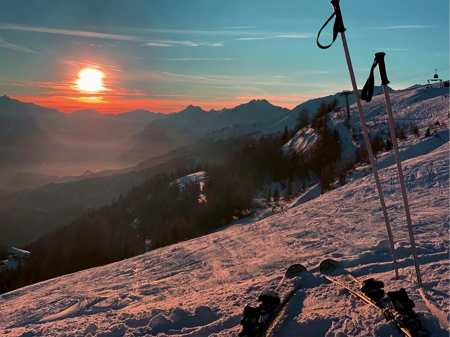 Start of a sunset while skiing down the mountain in crans montana