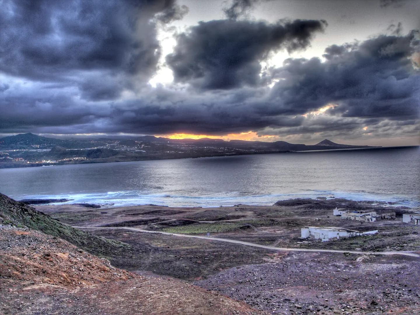 Sun putting in El Confital, Las Palmas de Gran Canaria. Canary Islands
