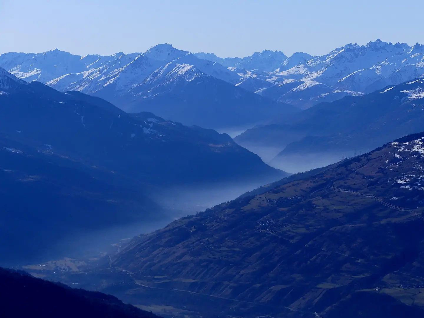 Sight, on a Saturday winter from La Rosière ski resort, of smog due to the thousands of the vacationers' cars, in Tarentaise valley, Savoie , France