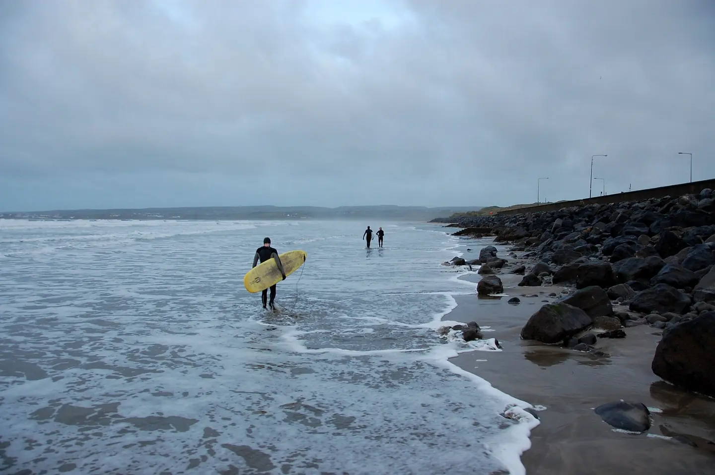 Surfers getting ready to catch some waves at Lahinch, December 2012