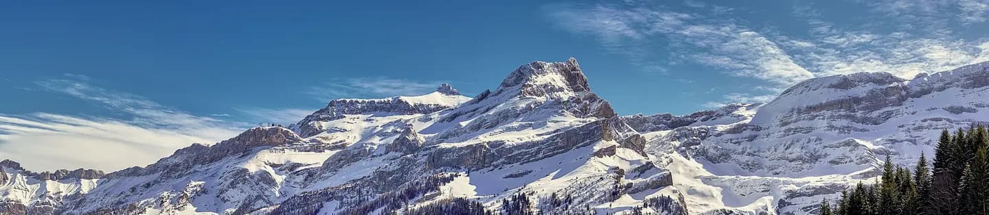 Glacier 3000 Les Diablerets Massif With Cable Car Middle Station and Freeride Tracks on the Slopes. View from Les Diablerets Skiing Slopes