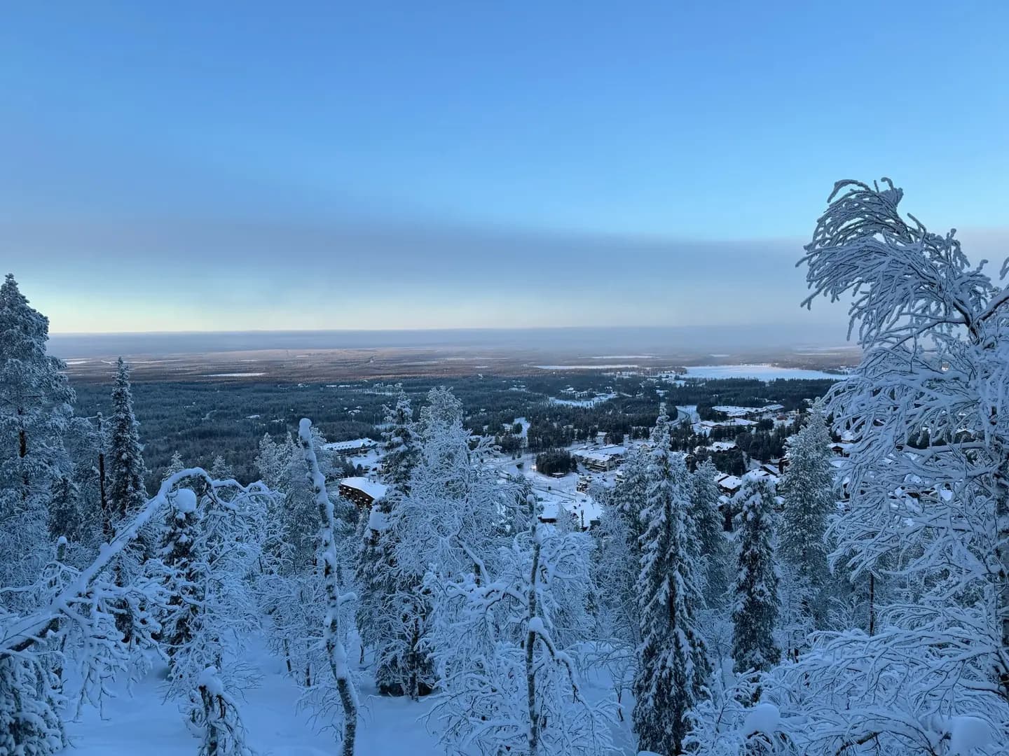 View at dusk looking over the snowy ski town of Levi