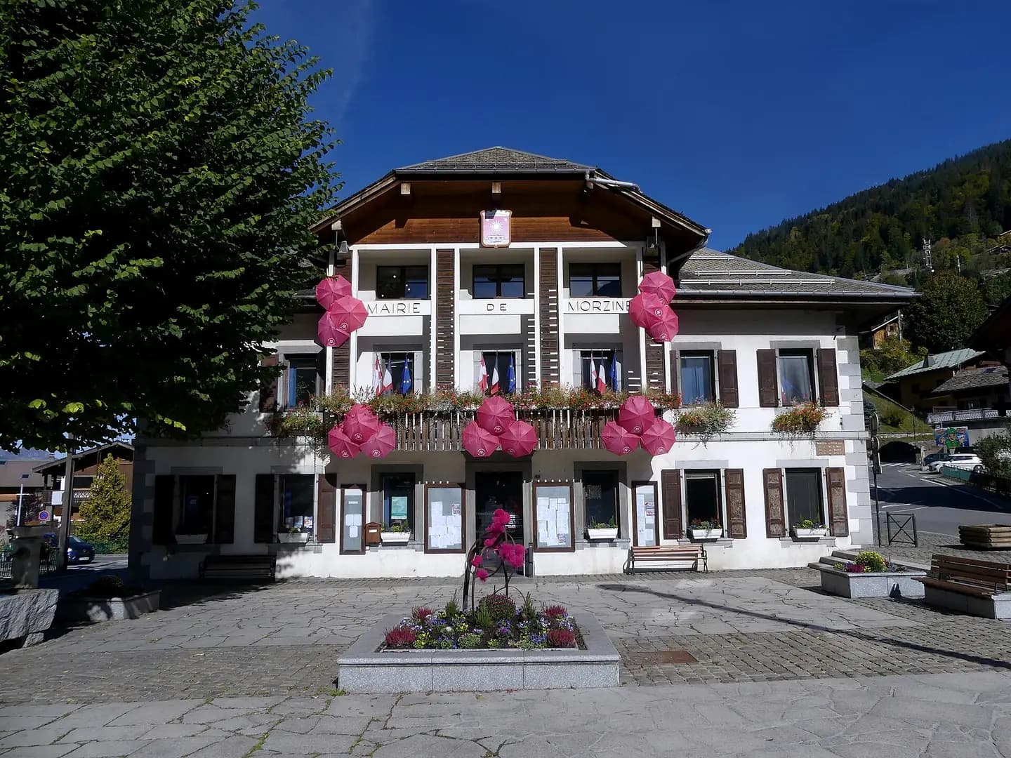 Sight of Morzine town hall with colors of Breast Cancer Awareness Month, in Haute-Savoie , France