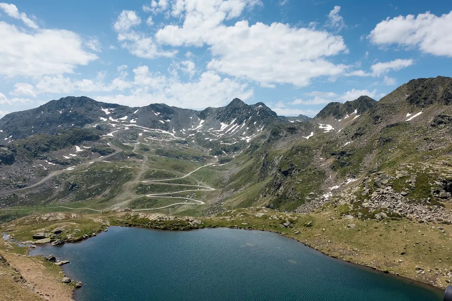 View from the Creussans chairlift over Lake Creussans and the Serra del Cap de la Coma mountain range in Andorra