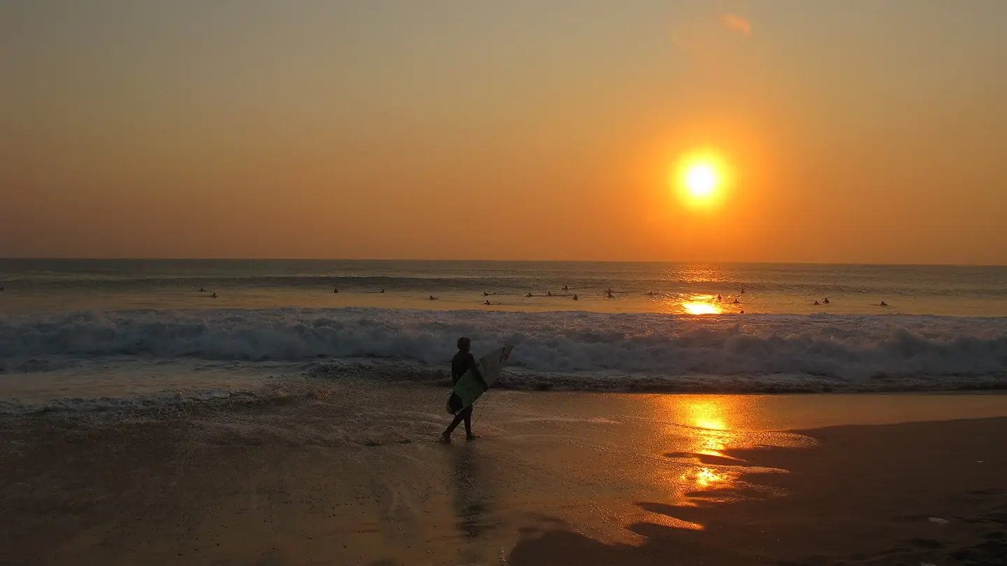 surfer in Supertubos (Peniche, Portugal)