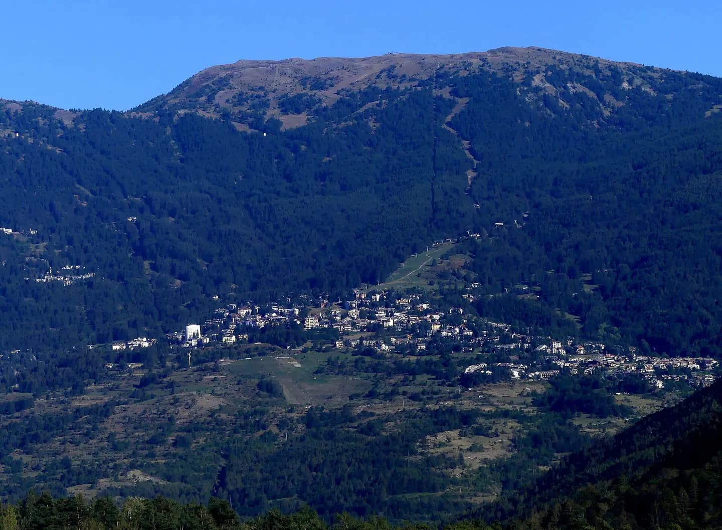 Sight, in the end of afternoon from A32 motorway near Oulx , of Sauze d'Oulx village and ski resort, in Susa Valley , Italy