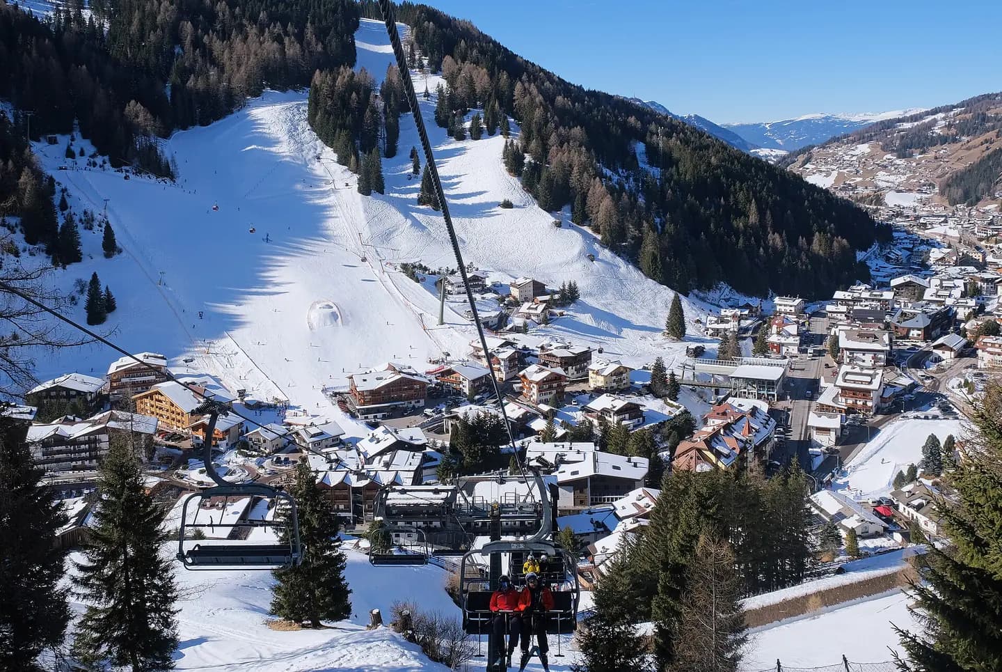 Sëlva town seen from Costabella chair lift, Val Gardena ski center, Dolomiti Superski