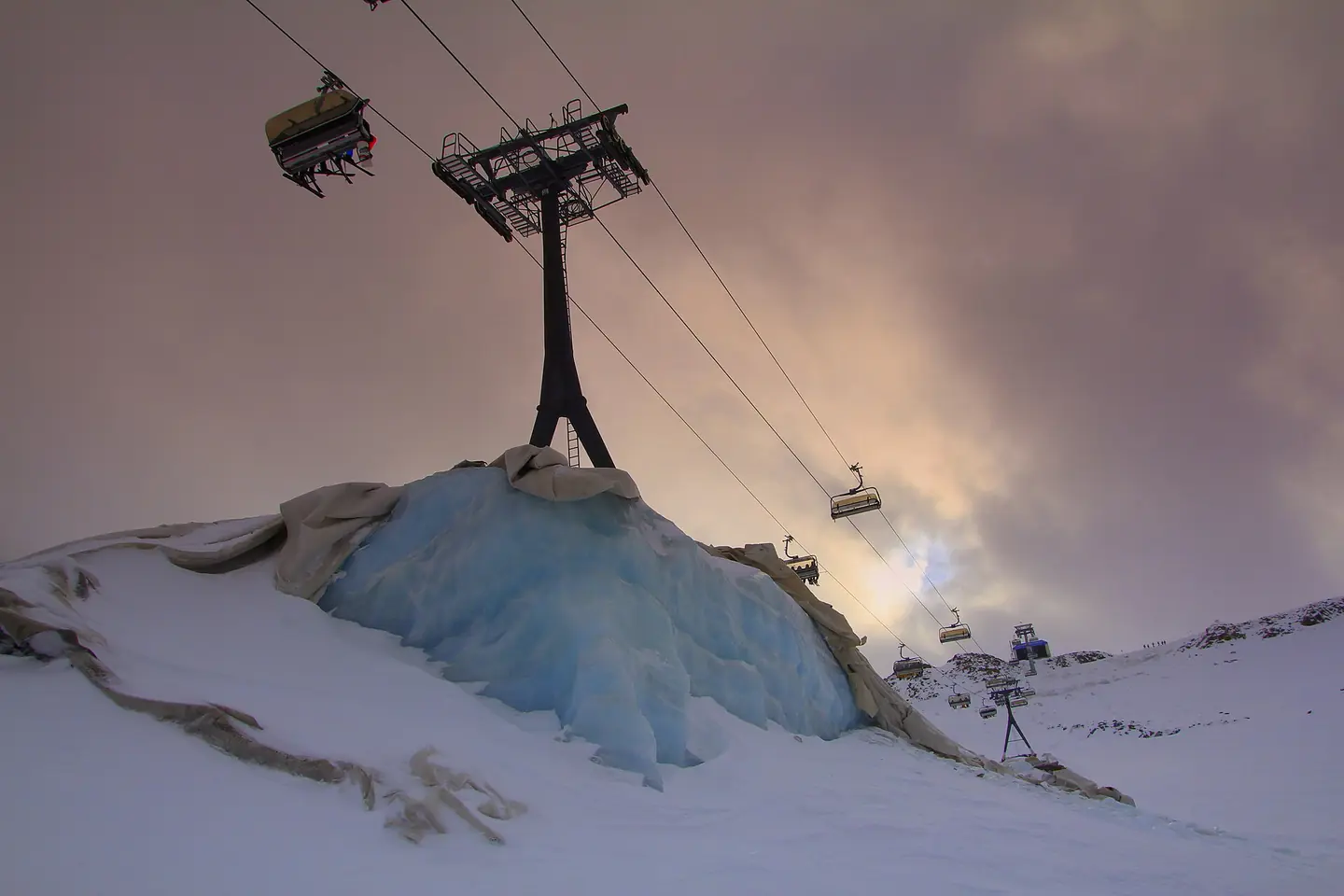 Stubai glacier, ski lift ice basis, partially covered with material against sun