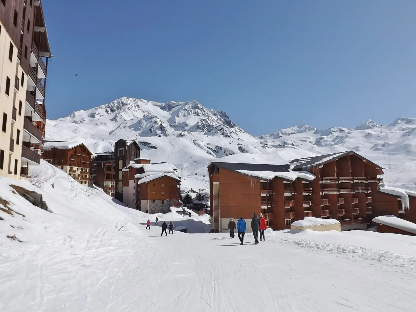 Sight of a street also ski slope along Val Thorens ski resort village, in Savoie , France