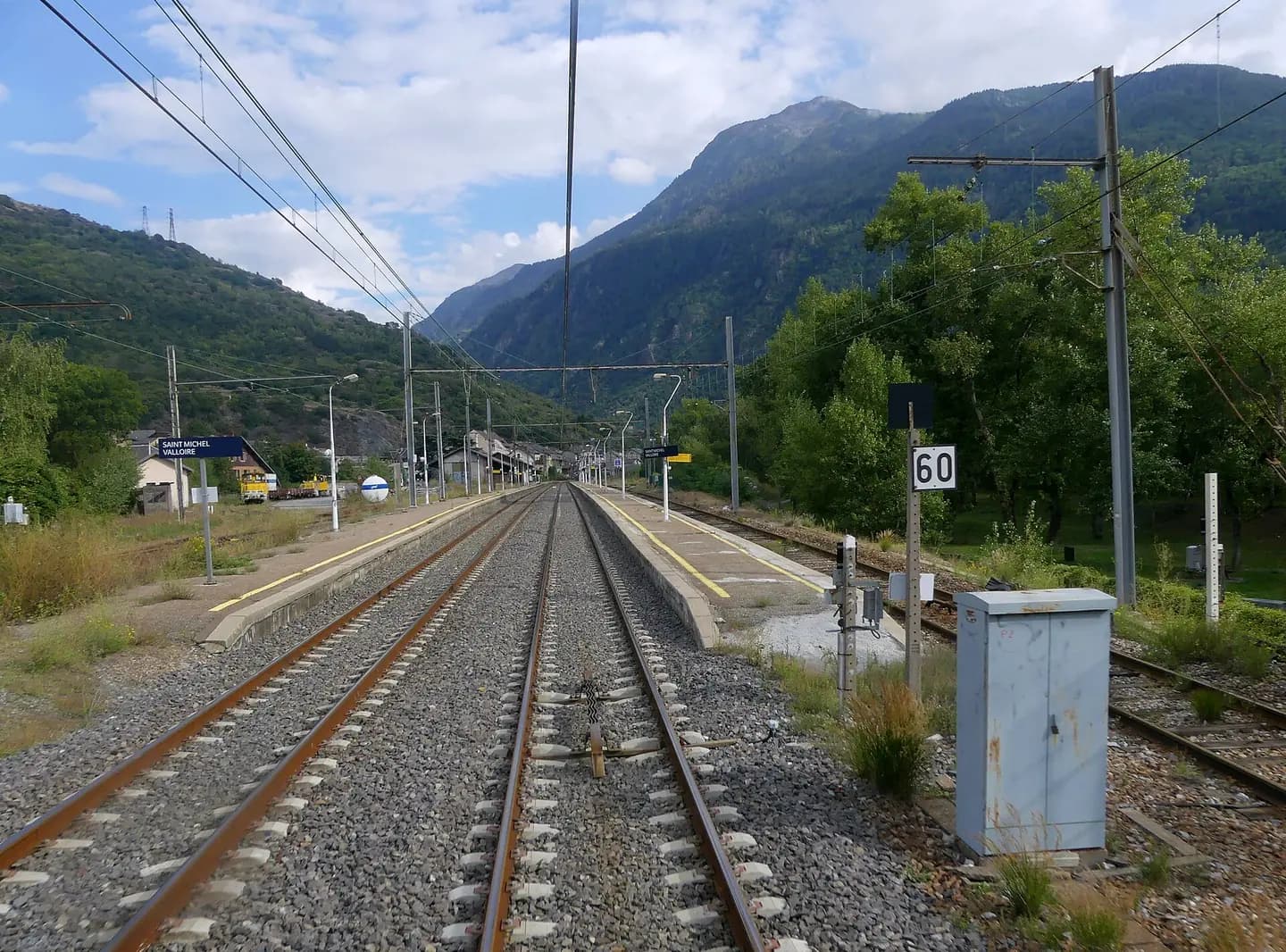 Sight, from the tail-end car of a train, of Saint-Michel-Valloire station in the Maurienne valley, Savoie , France