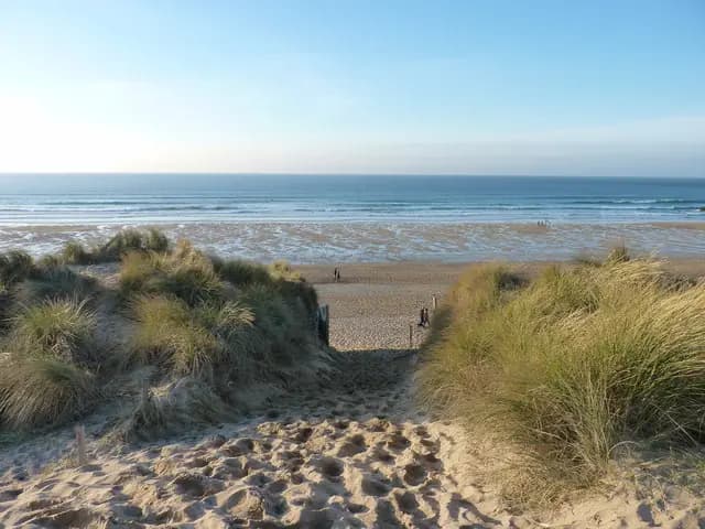 Arriving at Newquay's Fistral Beach via the dunes