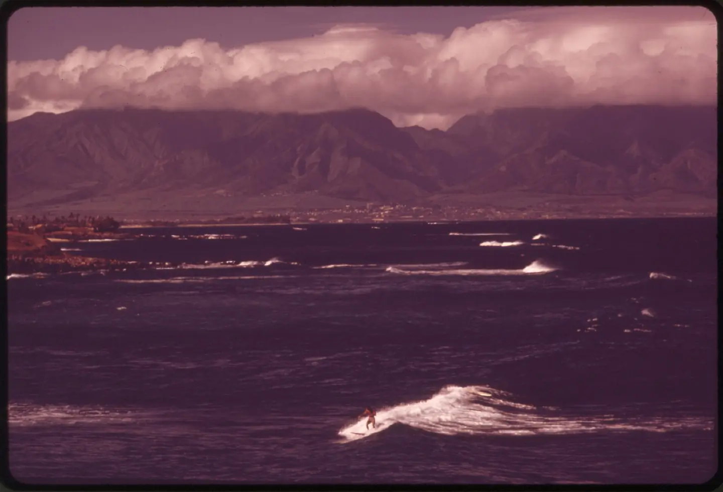 MAUI COUNTY'S HOOKIPA PARK, WHERE SURFING IS A POPULAR SPORT TOWNS OF KAHULUI AND WAILUKU IN BACKGROUND