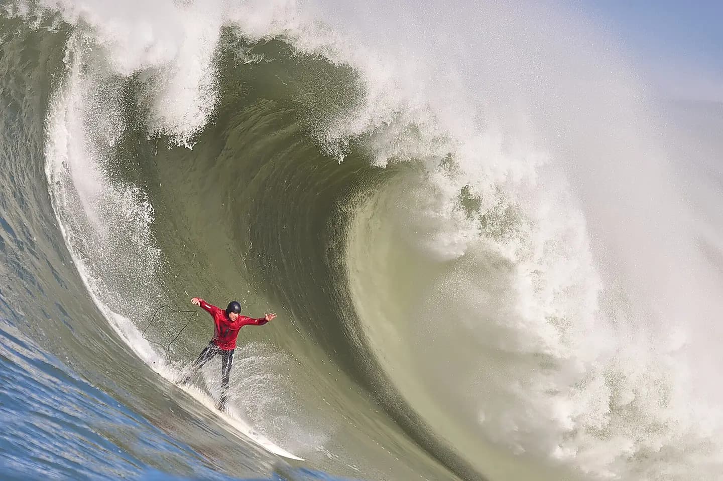 Surfer takes on a massive wave in Halfmoon Bay during the Mavericks Surf Contest