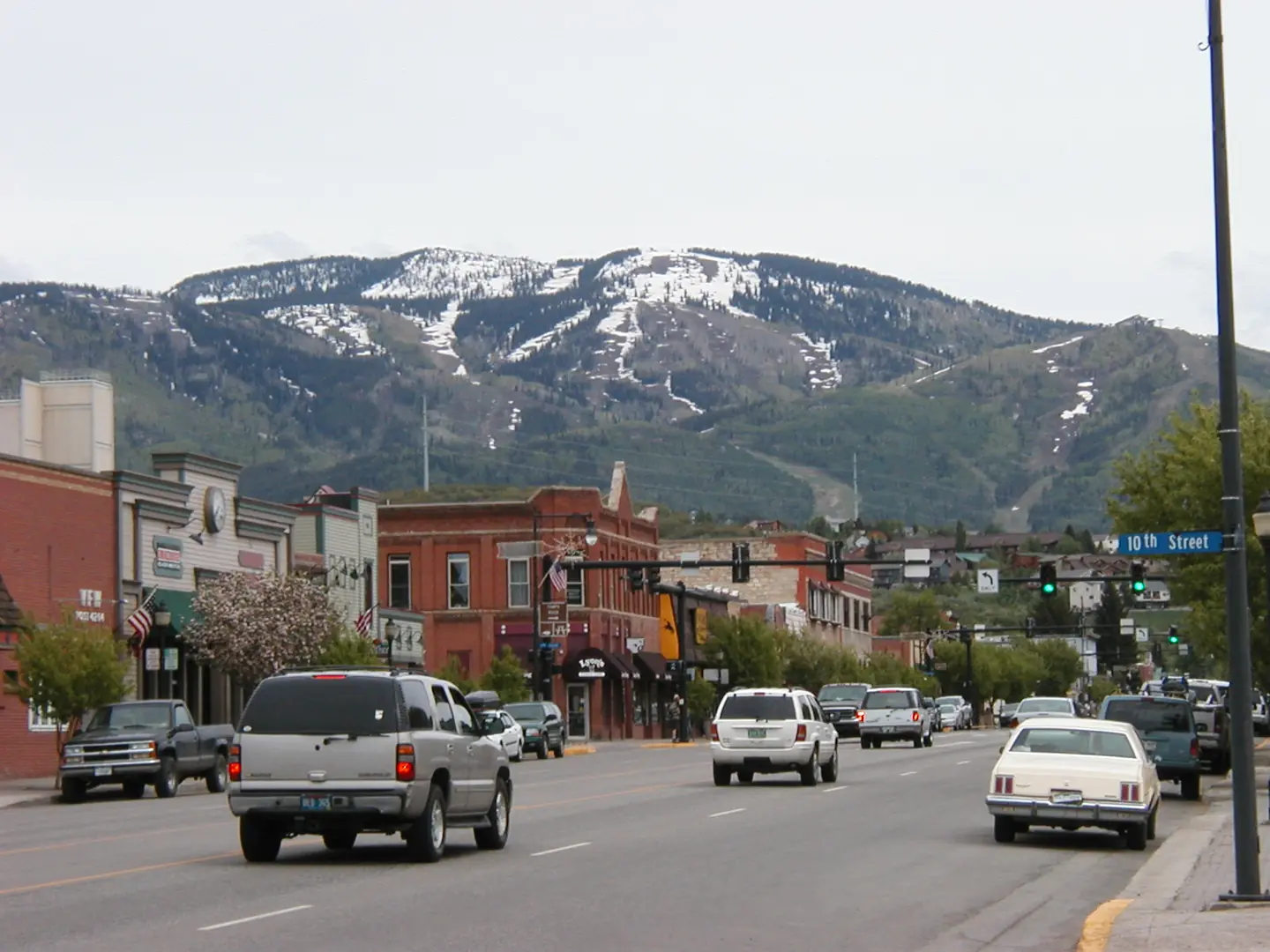 Downtown Steamboat Springs at the end of May; the mountain has still large patches of snow; original title: "Downtown Steamboat Springs", original description: "There's still snow on the mountain at the end of May"
