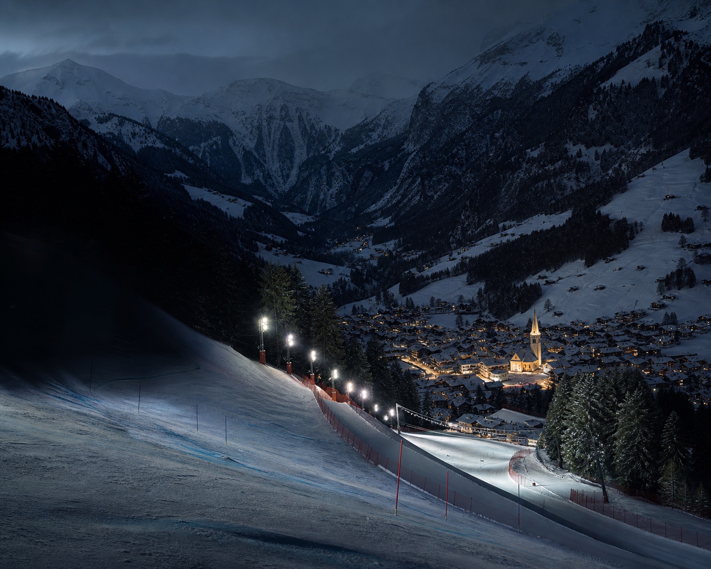 The steep Chuenisbärgli piste descending towards Adelboden village