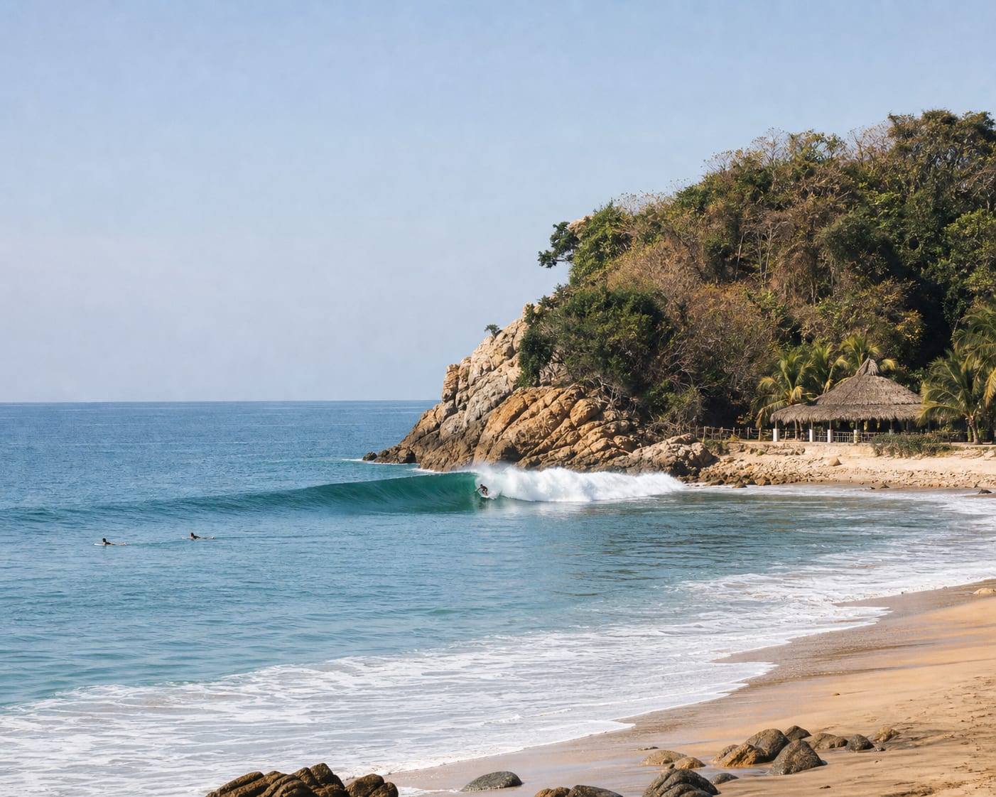Barra de la Cruz's long right-hand wave peeling from its rocky headland