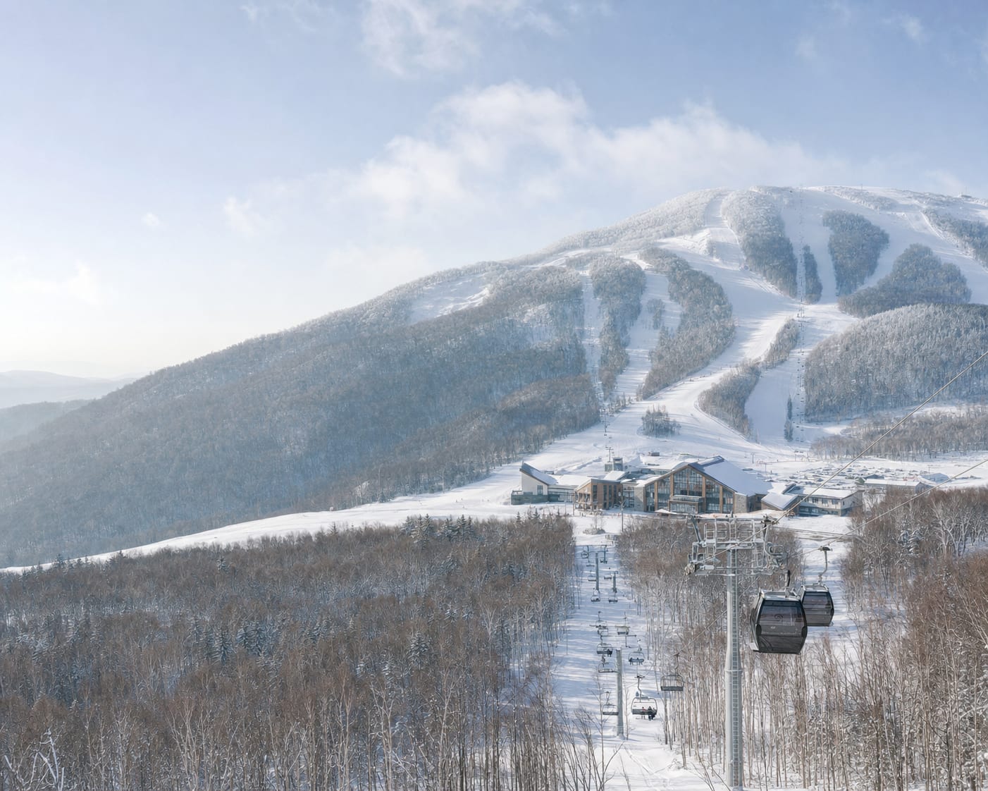 Beidahu gondola and pistes crossing the snowy birch forests of Jilin