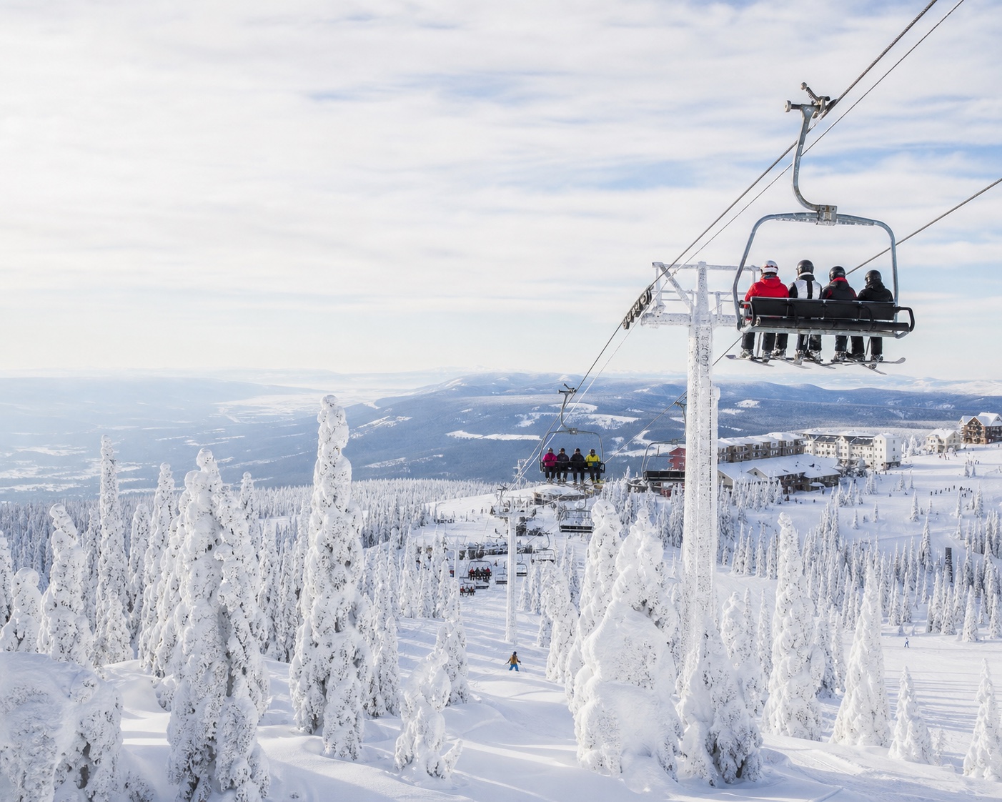 Big White chairlift weaving through its extraordinary snow-ghost forest