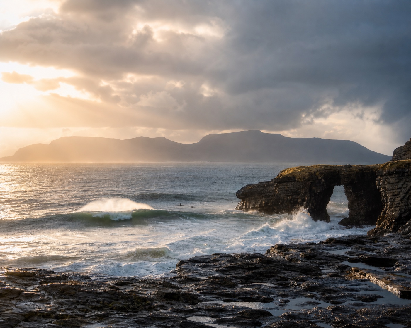 Atlantic swell beside the Fairy Bridges sea arch on Bundoran's Roguey cliffs
