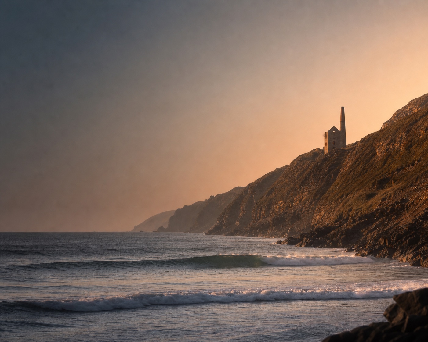 Chapel Porth surf beneath the Wheal Coates engine house and chimney