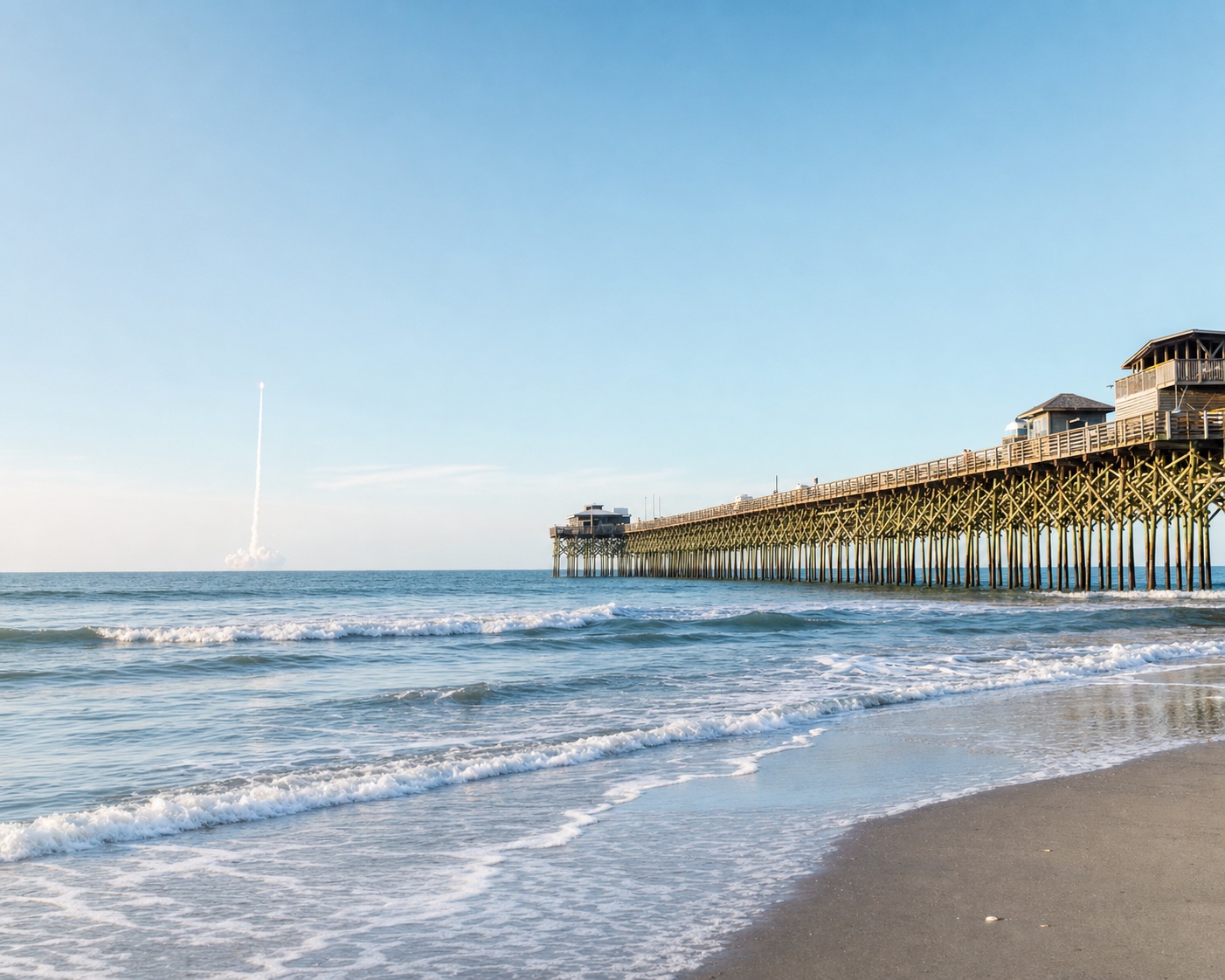 Cocoa Beach surf beneath its historic Space Coast fishing pier