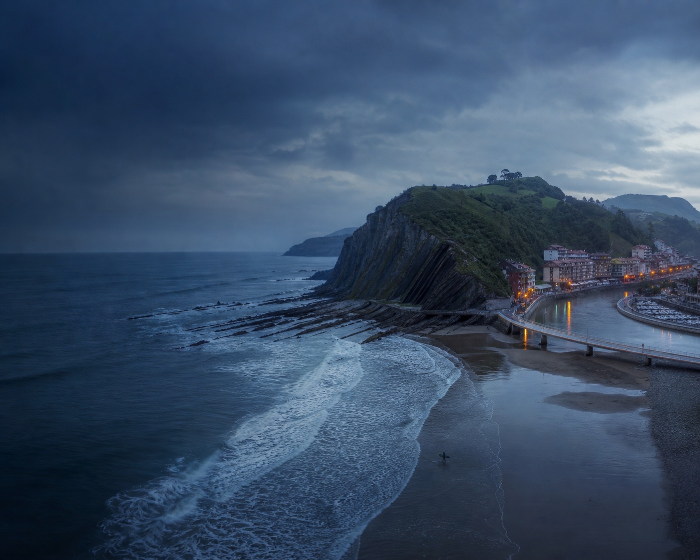 Deba surf, river mouth and marina beneath the Basque flysch cliffs