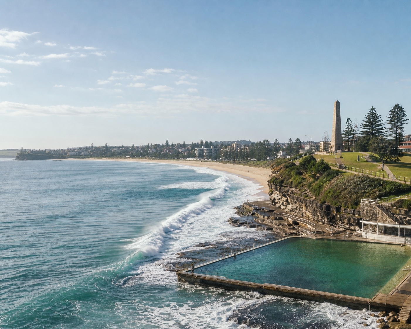 Dee Why point surf beside its ocean pool and headland obelisk