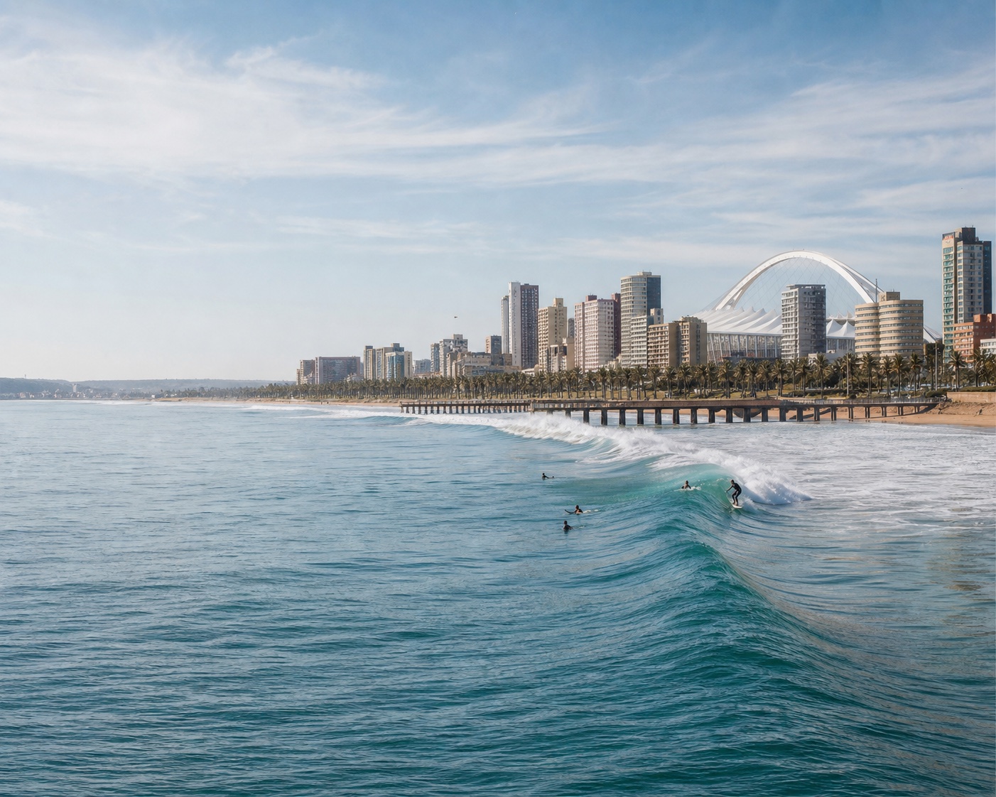 Bay of Plenty surf beneath Durban's skyline and stadium arch