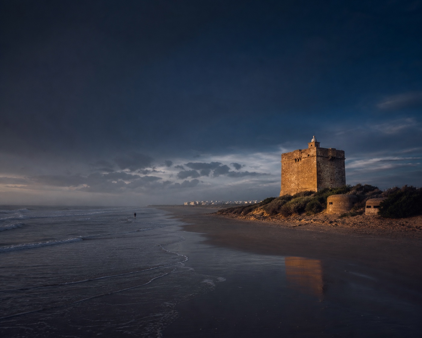 El Palmar surf and dunes beneath the 16th-century Torre Nueva