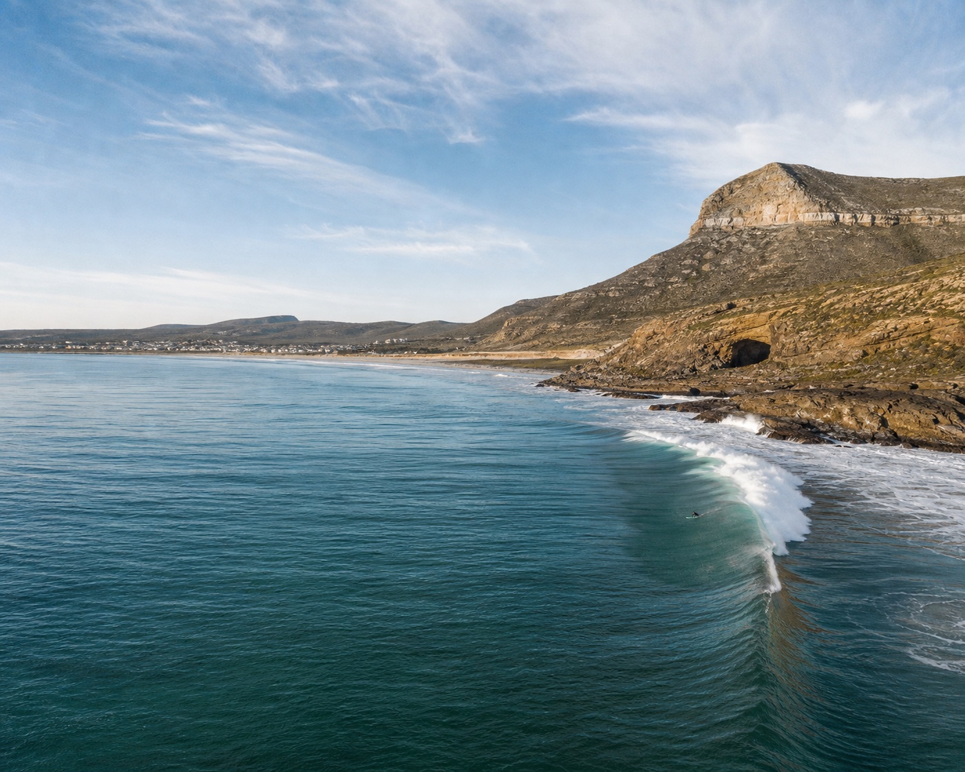 Elands Bay surf wrapping around Baboon Point and its cave
