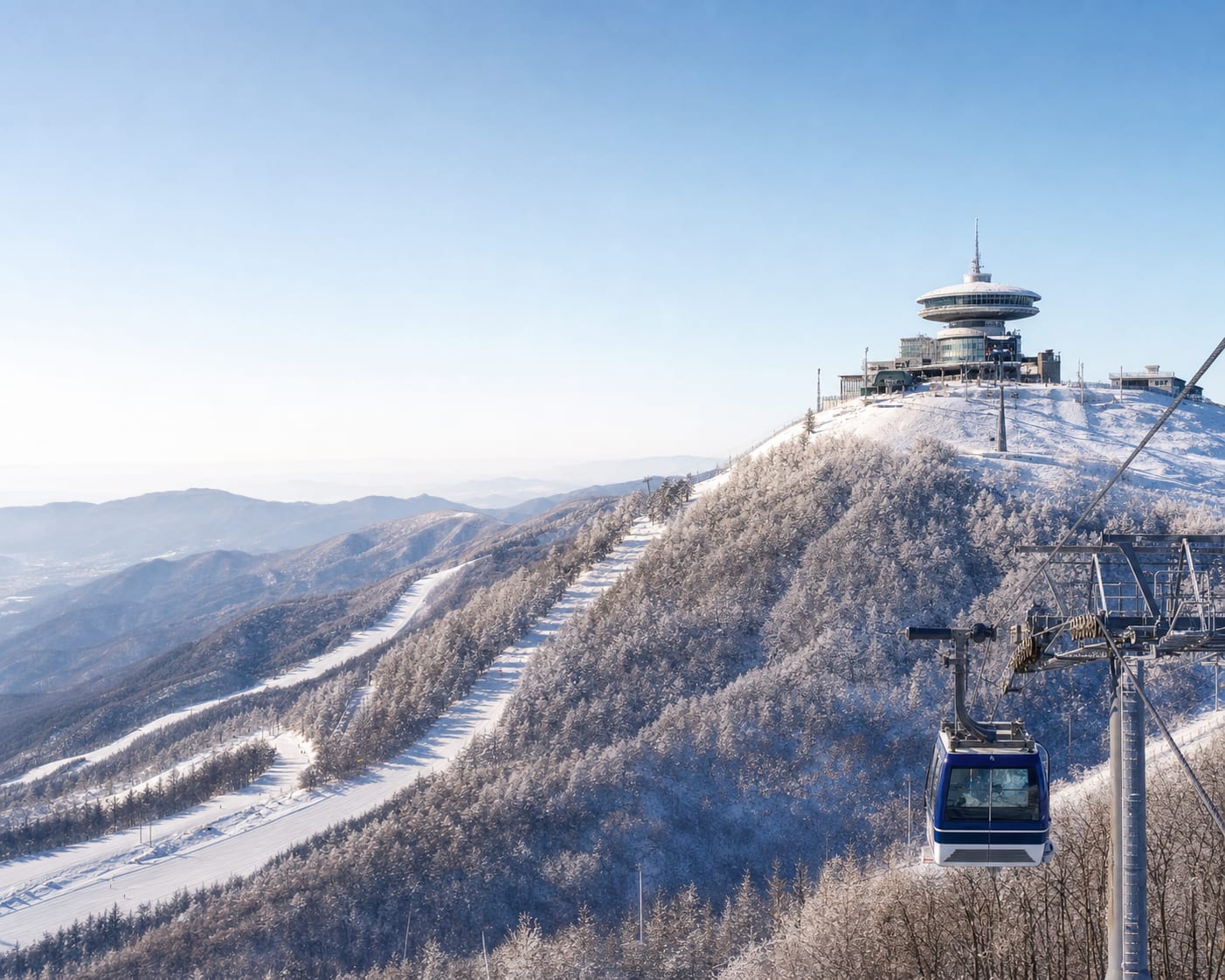 High1 gondola approaching its circular Mountain Top building in the Taebaek hills