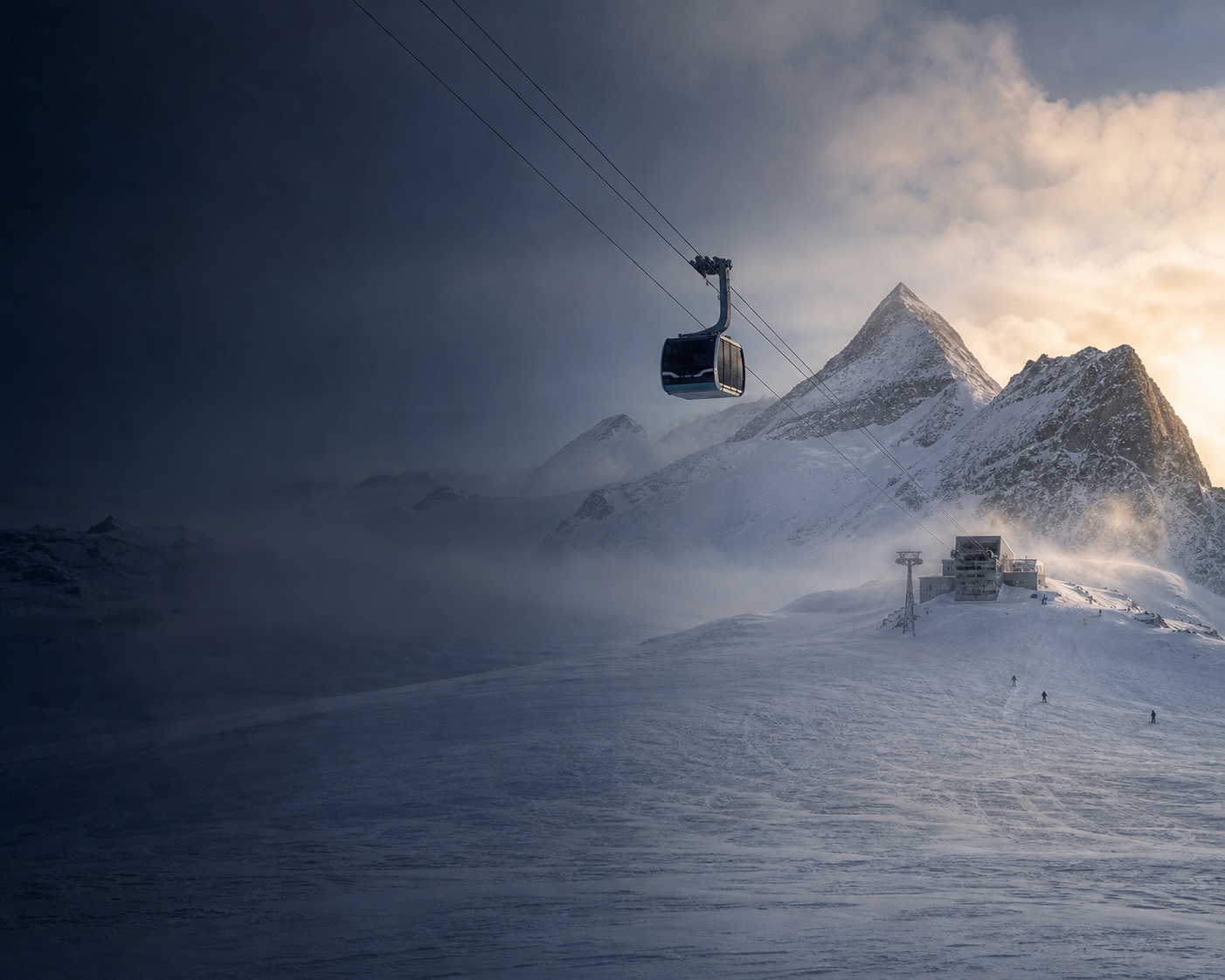 A glacier gondola crossing beneath the Olperer above Hintertux