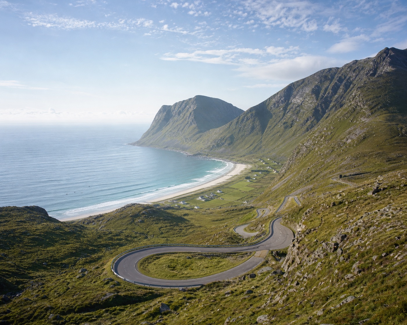 Hoddevik's hairpin road descending towards its surf-filled bay