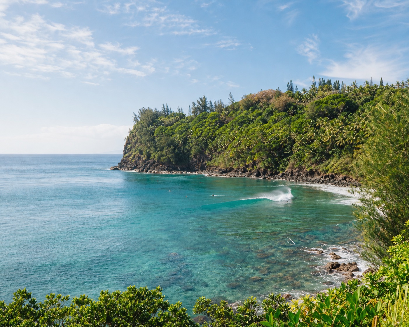 Honolua Bay's right-hand wave peeling around lush Kalaepiha Point