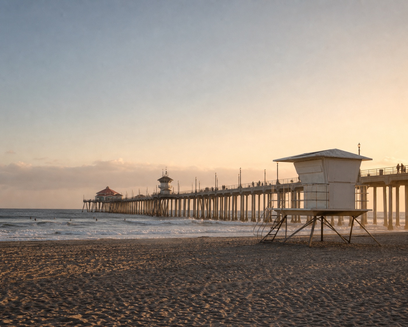 Huntington Beach Pier and a lifeguard tower in soft golden-hour light