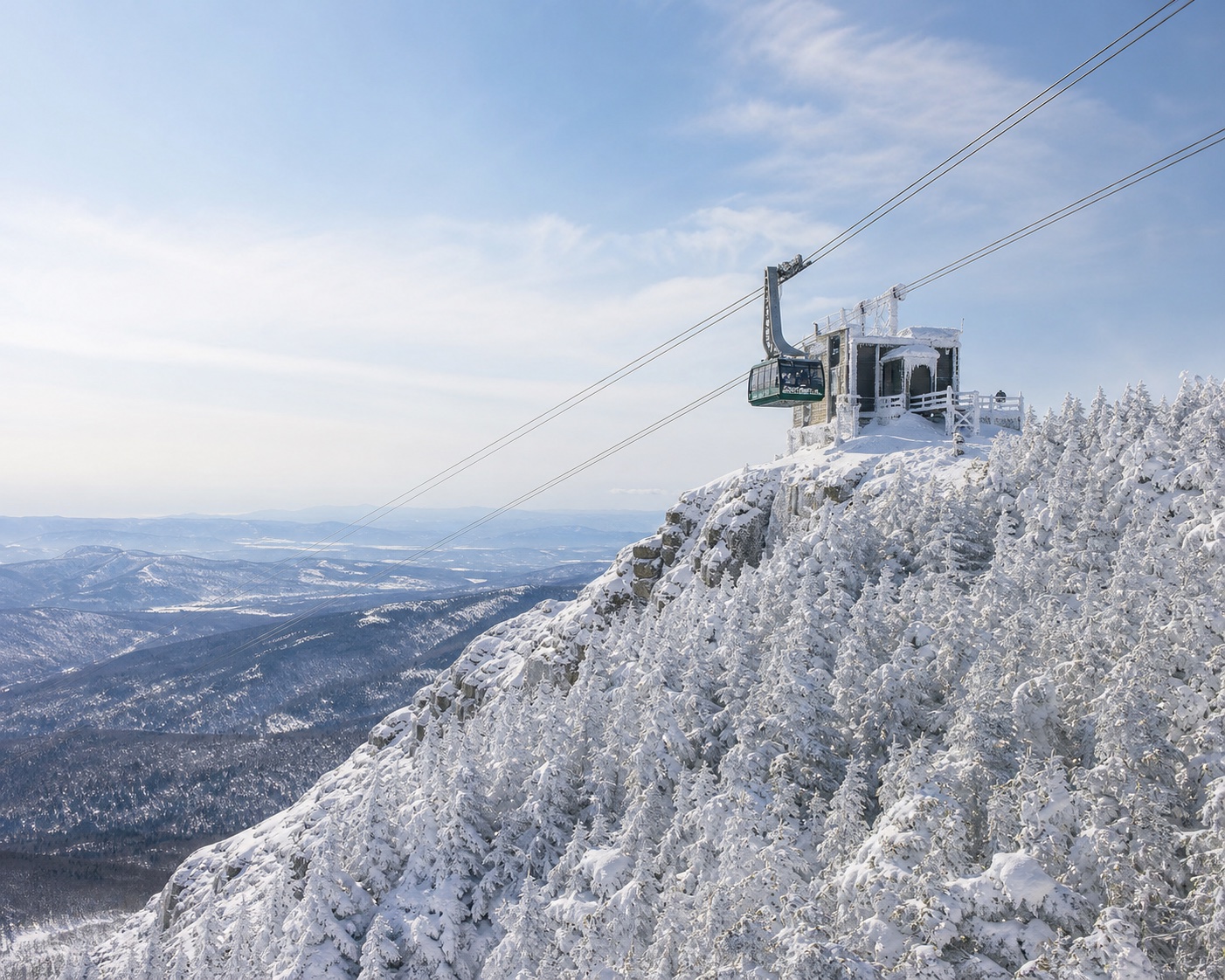 Jay Peak's aerial tram approaching its rime-covered summit station