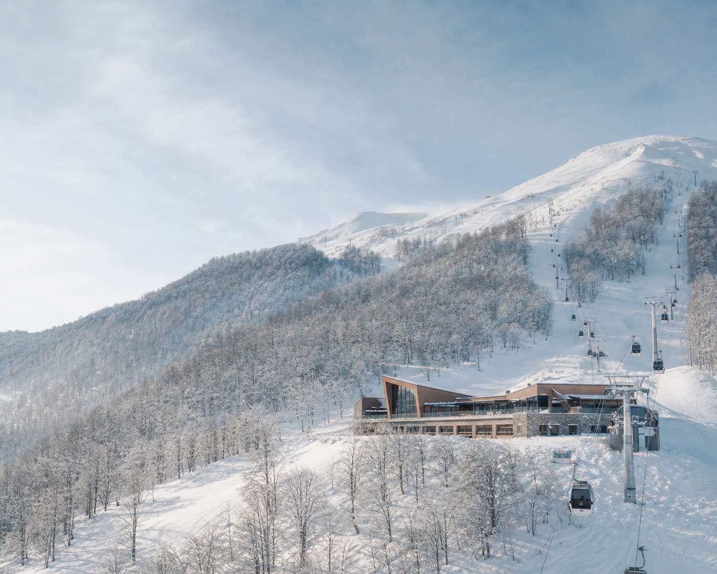 Kolašin 1600 gondola and lodge among Bjelasica's snowy forest