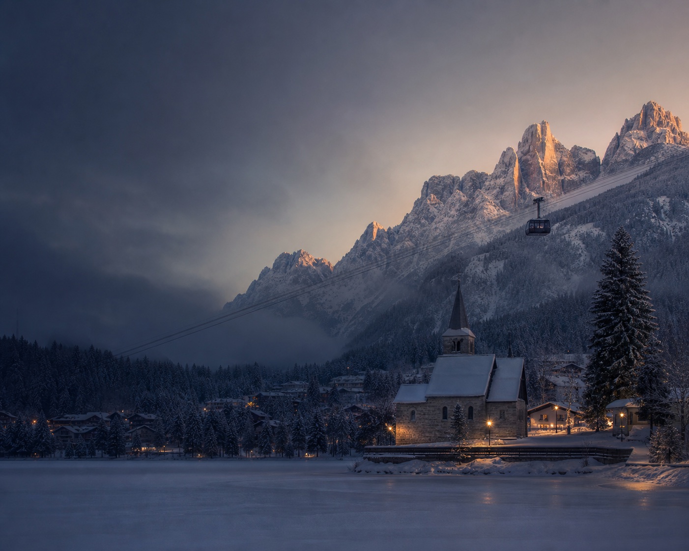 Madonna di Campiglio's lakeside church beneath the Brenta Dolomites