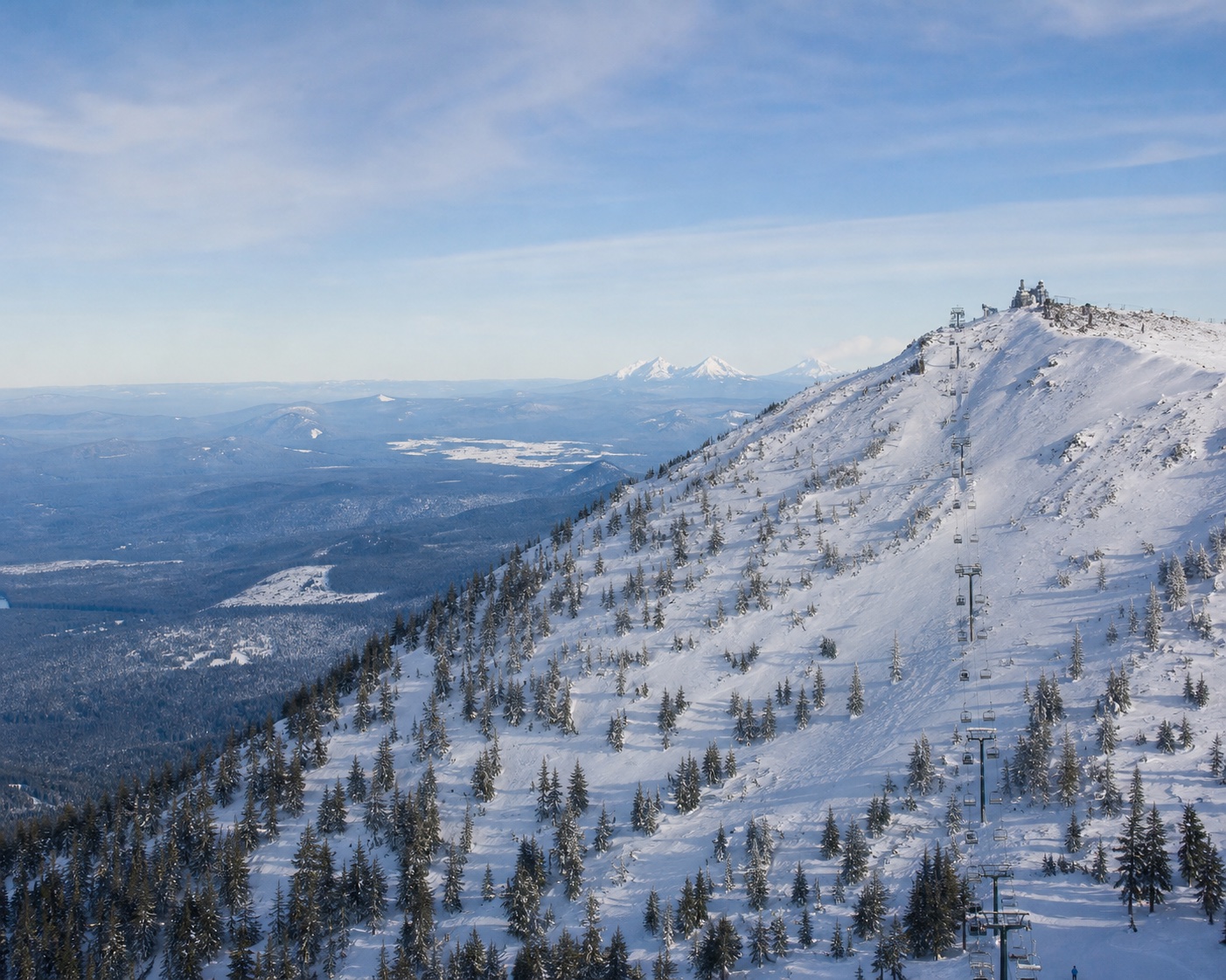 Mount Bachelor's Summit chair climbing the snow-covered volcanic cone