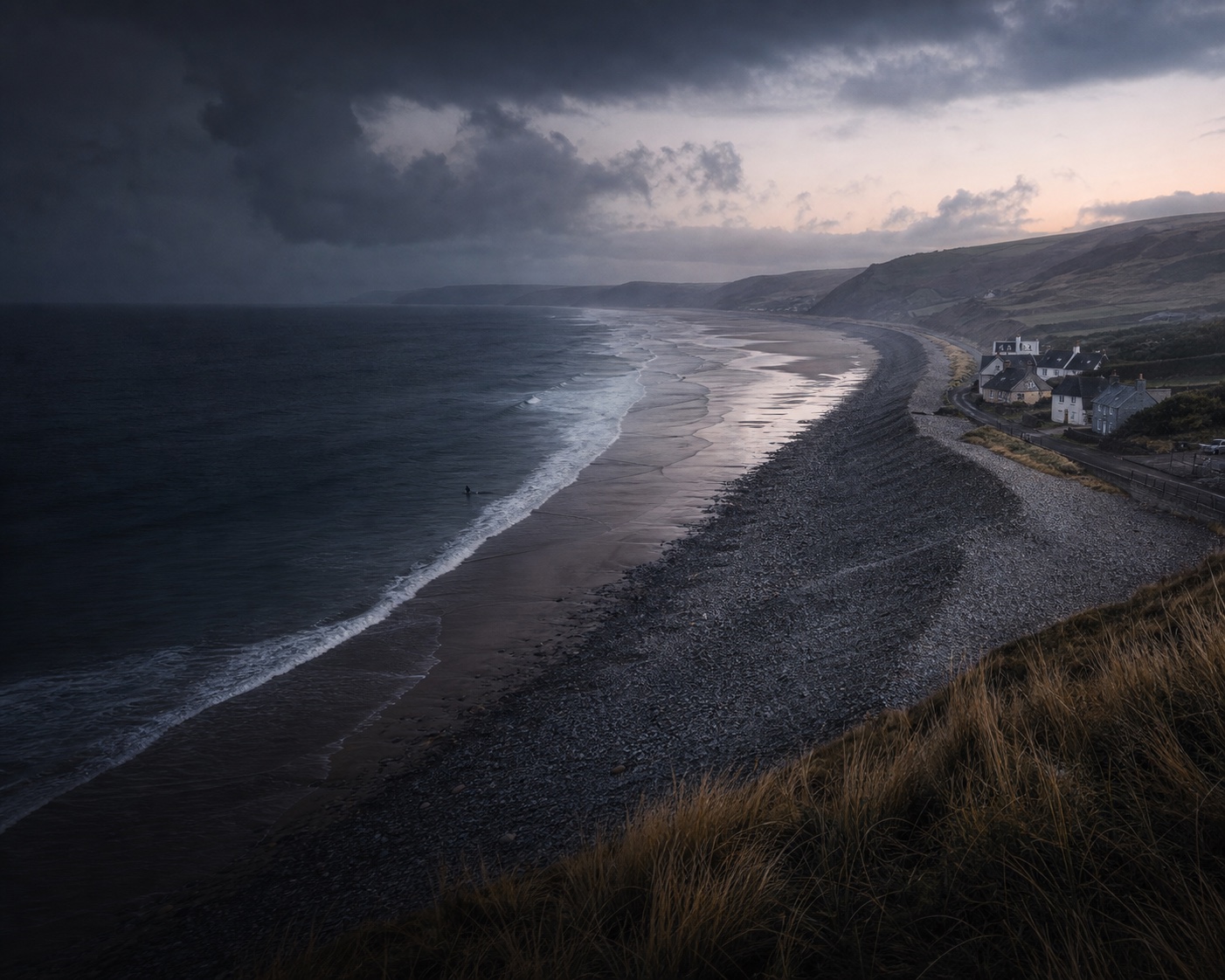 Newgale's long surf beach and storm-built pebble bank at Atlantic dawn