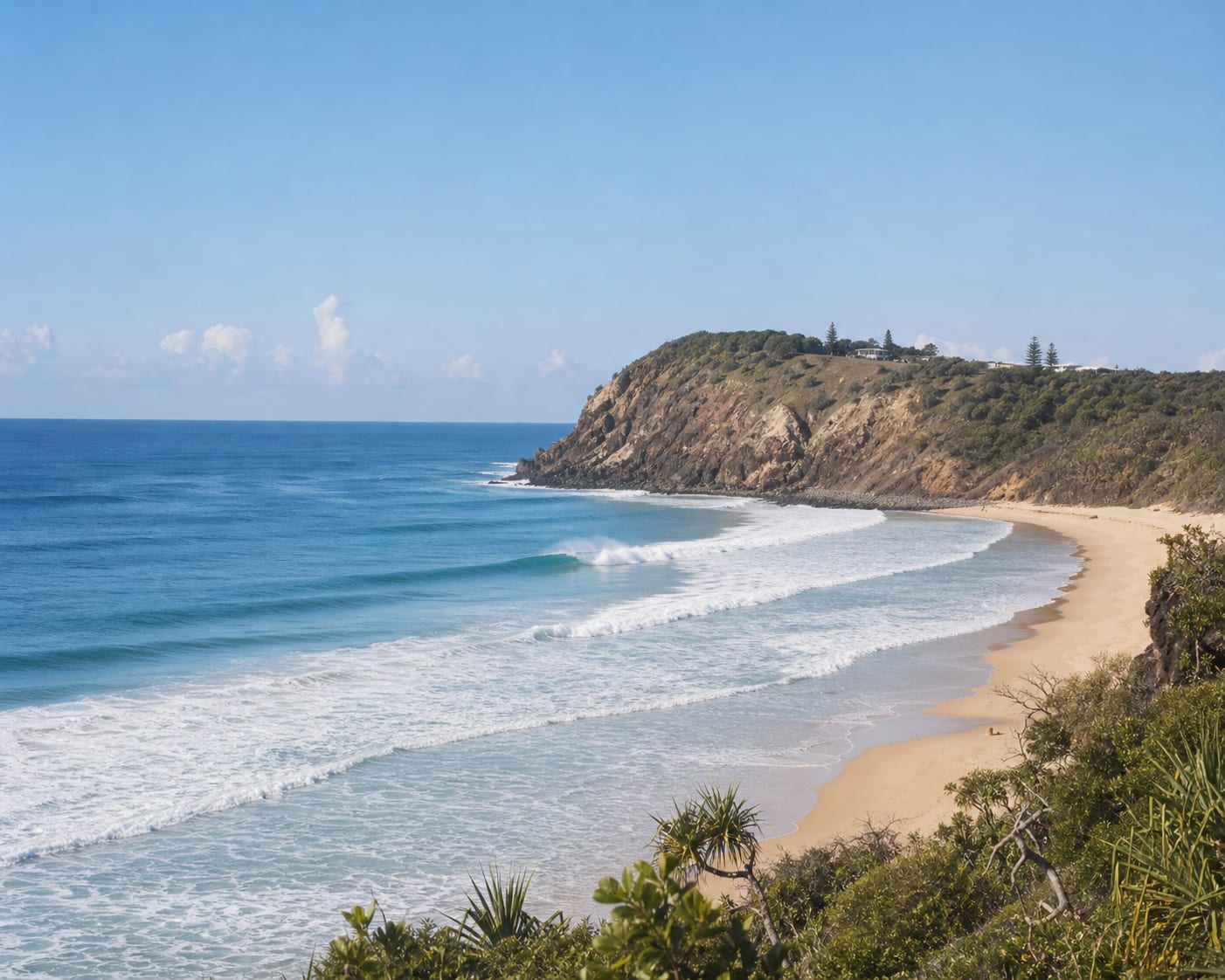 North Stradbroke surf running beneath the ochre headland at Point Lookout