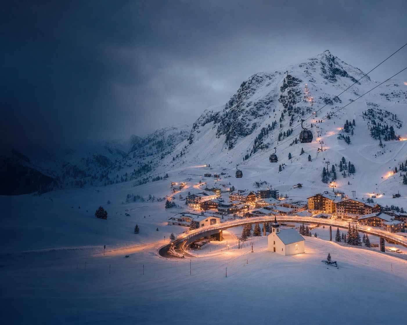 Obertauern's pass village, ski bridge and gondola beneath the Gamsleiten