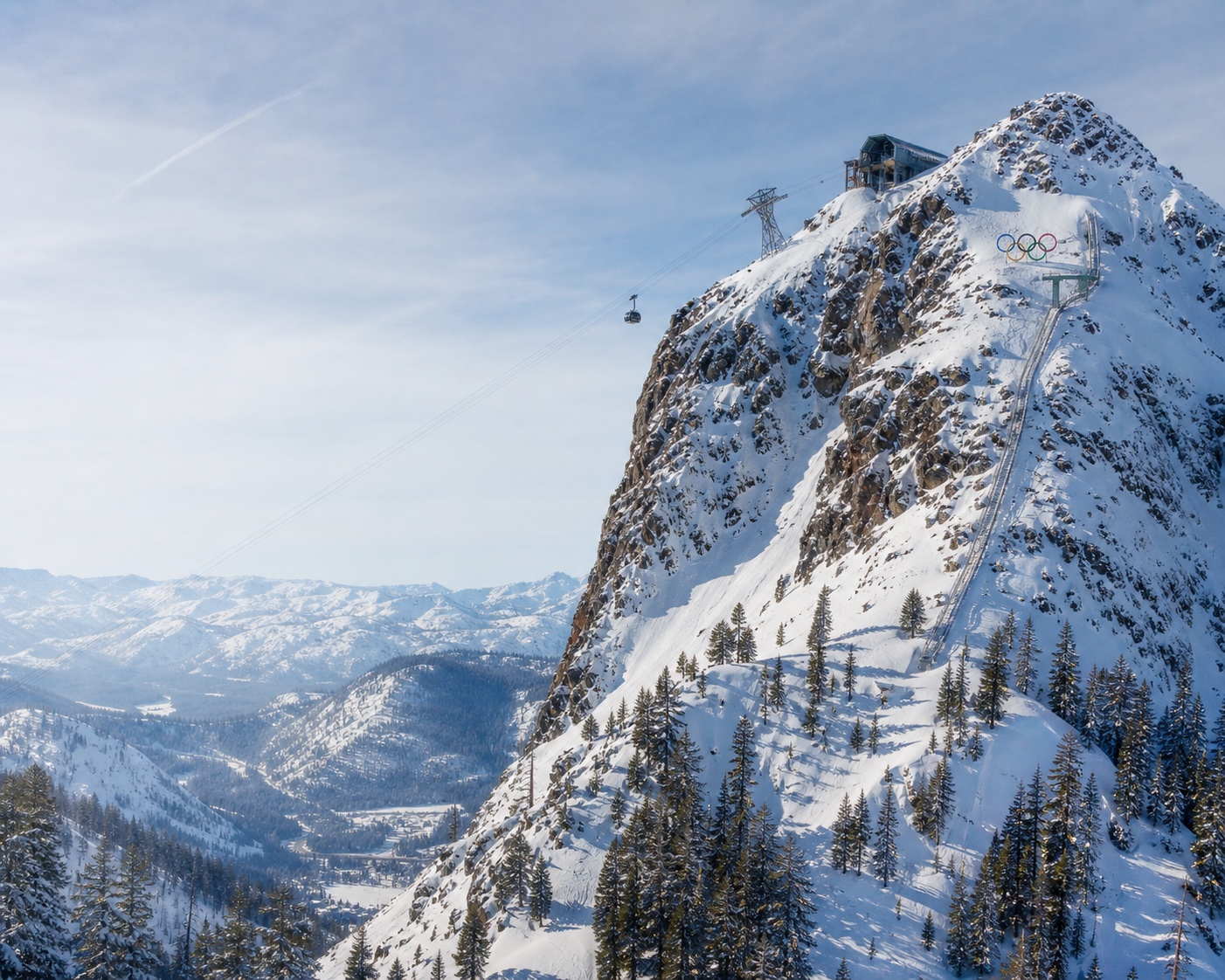 Palisades Tahoe tram climbing the crags of KT-22 above Olympic Valley