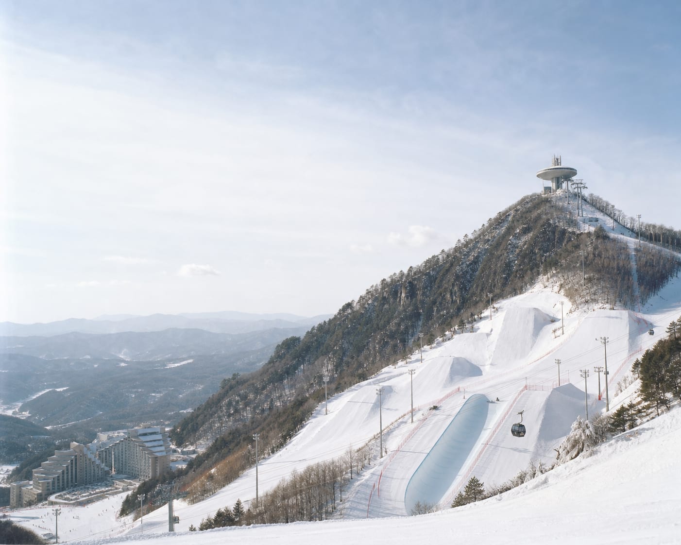 Phoenix Snow Park's Olympic halfpipe beneath its Mont Blanc summit station